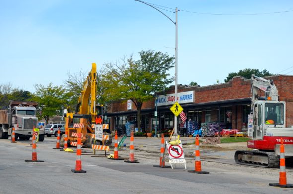 Utility crews were at work as usual on Johnson Drive Friday morning. Drivers sometimes find it difficult to negotiate the cones into business parking.