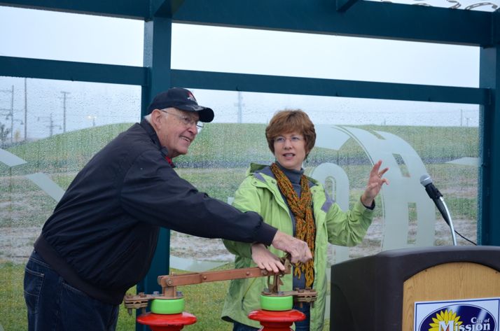 Mission resident Bill McCrea helped Mayor Laura McConwell throw the switch at Martway and Broadmoor.