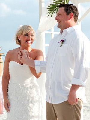 Mogenson's Facebook profile photo, a picture of her wedding day in 2012 with husband Michael.