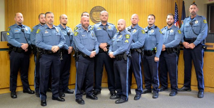 Mission police officers who participated in No-Shave November assembled before turning over their contributions to SAFEHOME.