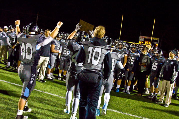Team captains held the Regional title up for the rest of the team after the Lancers defeated Leavenworth Friday.