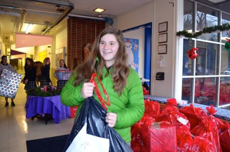 Margaret Ruhlman was helping with the Christmas distribution Friday.