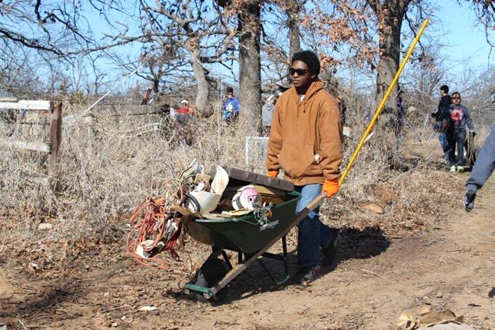 SM North students clear tornado debris from a property near Moore, OK.
