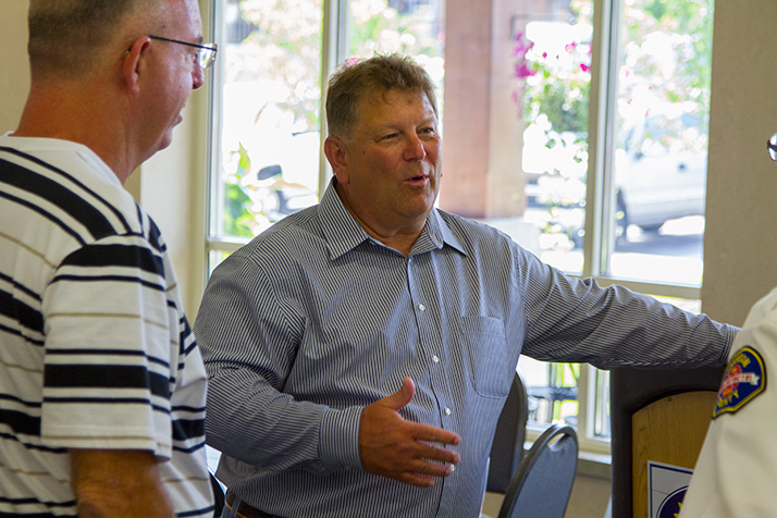 Gary Lamons chatted with friends at his retirement celebration at Sylvester Powell, Jr., Community Center in Mission Friday.