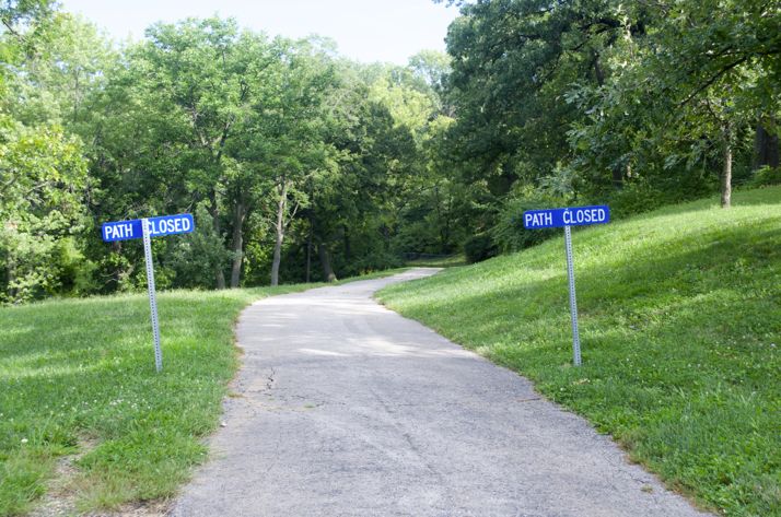 The walking path that runs east towards the community center is closed because of erosion.