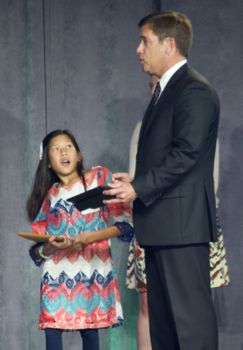 Trailridge Middle School student Cate Cunningham takes on Dr. Hinson in a robot challenge directed on iPads.