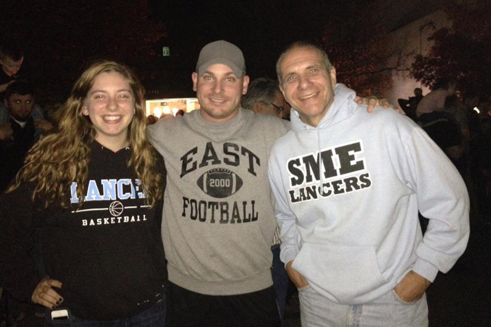 Tim Grimes, center, with his sister Kennedy and father Mark. The Grimes family lives in Fairway.