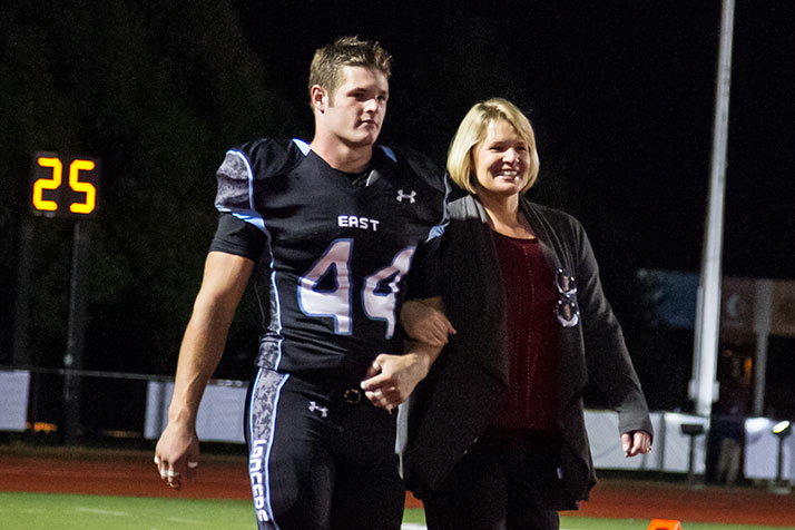Ball with his mother during the Homecoming game.