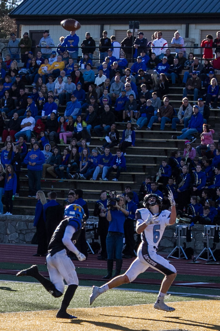 Charley White looked over his shoulder to zero in on the pass that would give the Lancers their final touchdown of the afternoon.