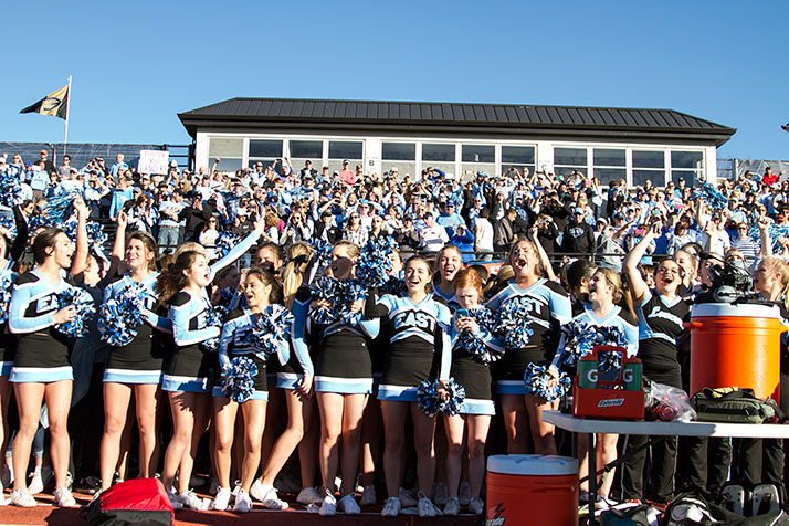 Lancer cheerleaders and fans gathered on the sidelines as the clock wound down, preparing to join the team on the field.