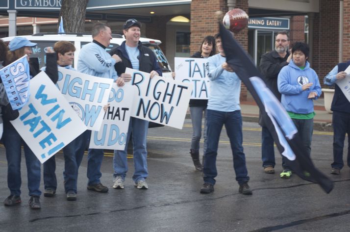 Fans were ready with their signs to greet the SM East football team this morning at Village Shops.