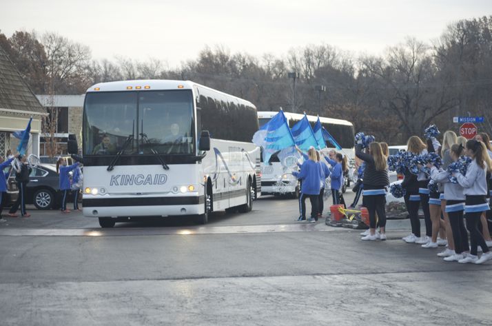 The buses rolled through to a cheering crowd.