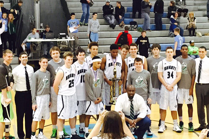 Barstow's basketball team celebrated with the Championship Showdown title trophy on the SM East court Saturday. Photo via Barstow Booster Twitter.
