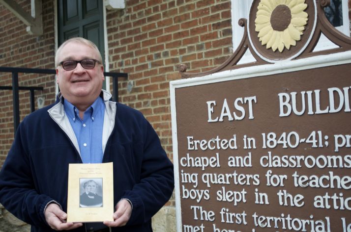 Author Joe Vaughan at the Shawnee Indian Mission with his new book that traces the history of the Mission and Fairway.