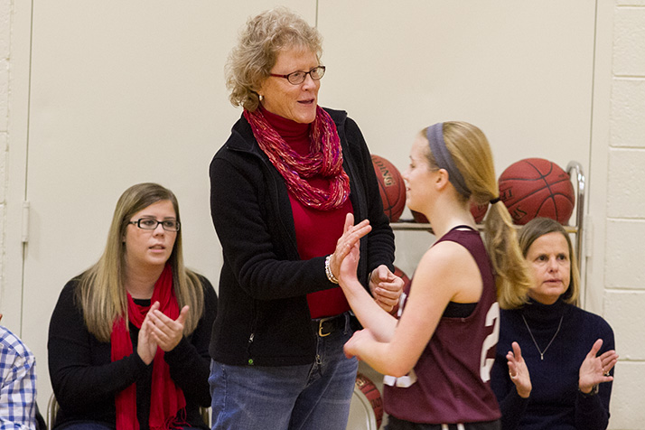 Coach Kathy Kreamer congratulated her team in the closing minutes of their 50-0 victory over Hocker Grove on Wednesday.