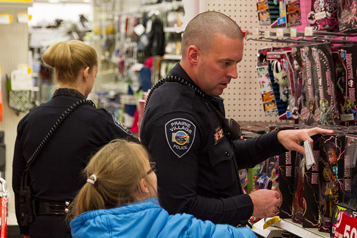 Prairie VIllage police officers helped 10 local kids shop for themselves and their families at the Mission Target Thursday afternoon.