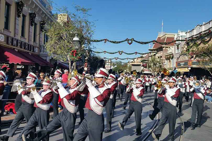 The SM North band marches through Disneyland.