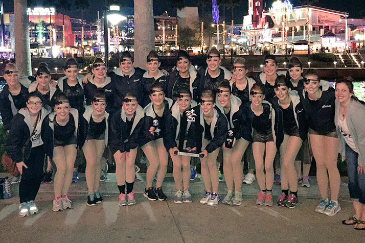 The Lancer Dancers with their second place trophy. Photo via Lancer Dancers Twitter.