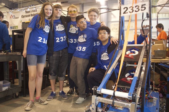 A few of the SM East team members with their robot back in the pits.