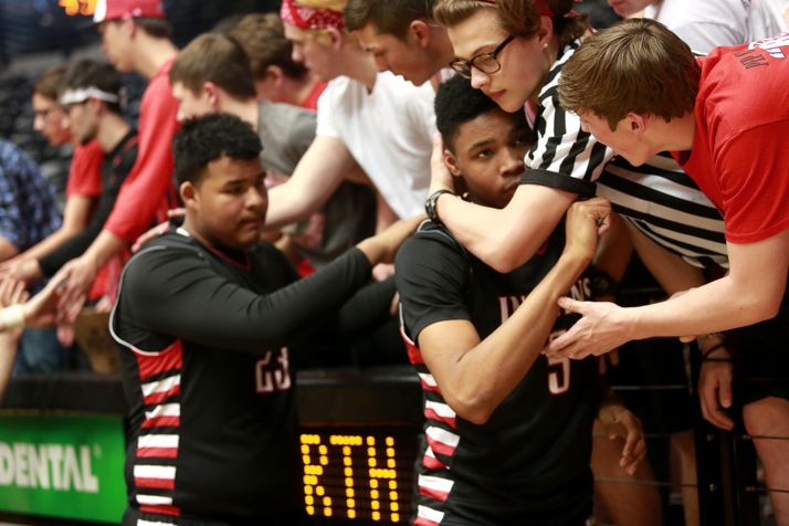 Marcus Weathers (right) and Devin Miller got condolences from SM North fans after the loss to Lawrence in Wichita Friday. All photos by Rachael Cunningham.