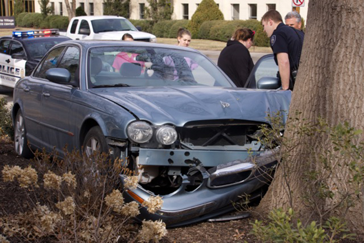 In February, a Jaguar hopped the curb and hit a tree on Mission Road. Photo courtesy Carol Tucker.