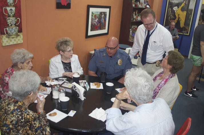 Capt. Kirk Lane and Det. Dan Madden (standing) answer questions during "Coffee with a Cop" Friday morning at Twisted Sisters in Mission.