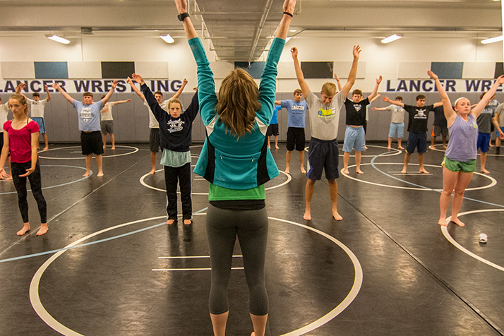 More than 50 student athletes participated in the first of three yoga sessions at SM East Wednesday.