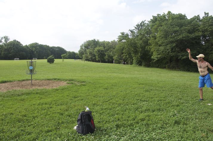 A player hits one of the baskets at the Rosedale disc golf course over the weekend.
