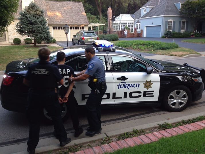 A suspect is taken into custody by Fairway police Tuesday evening after an apparent attempted burglary in Fairway was foiled by the homeowner. Photo provided.