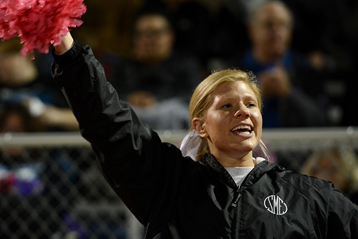 Senior Abby Hans cheers for the Lancers after a 40-yard touchdown run by senior Jack Tyler. Photo by Joseph Cline