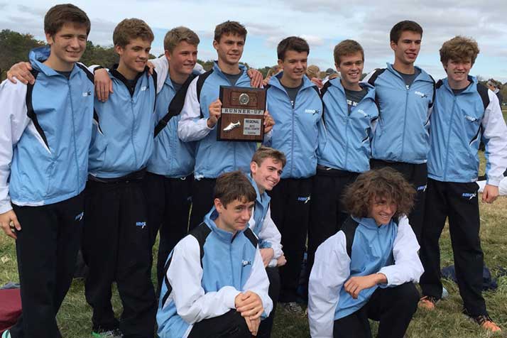 SM East's boys cross country team with their Regional trophy. Photo via Sid McKnight on Twitter.