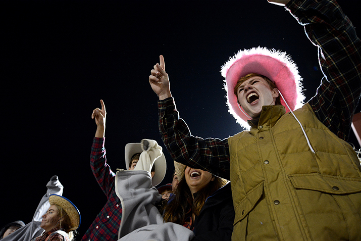 Senior Baker Stradinger cheers for the Lancers as they take a 21-0 lead in the first quarter. Photo by Joseph Cline