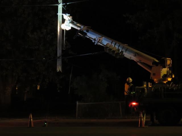 Crews removed a damaged utility pole after the crash Saturday. Photo via Dr. Carol Tucker.