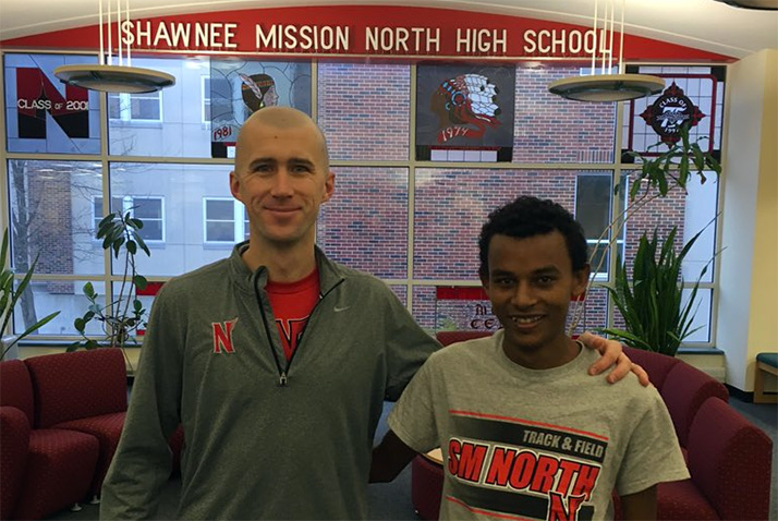 Coach Aaron Davidson with Belesit Akalu. Photo via SM North Twitter.