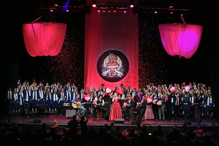 SM East graduate Abby Cramer belted out "Change the World" with the help of the Lancer choir at last week's Pipline "Innovator of the Year" ceremony.