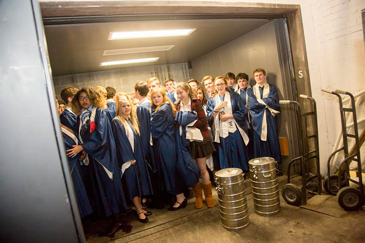 The choir members loading into a service elevator at the Midland.