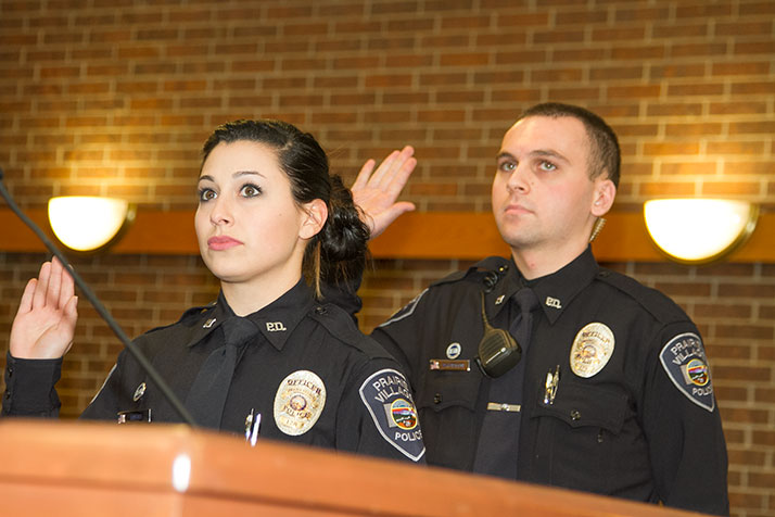Officers Noelle Burns and Andrew Davidson take the oath at Monday's Prairie Village City Council meeting.