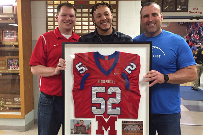 Bishop Miege coaches Jon Holmes (left) and Tim Grunhard (right) with Shane Ray.