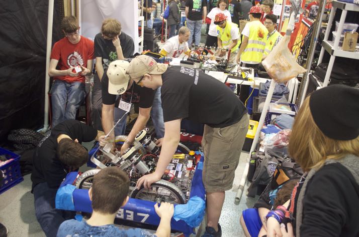 SM North team works on its robot in the pits.