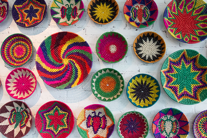 Colorful woven baskets adorn the wall of the main dining room.