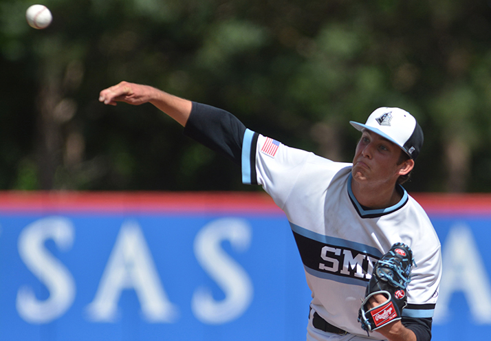 Senior Henry Miller delivers a strike in the 9th inning to prevent the Firebirds from scoring. Photo by Joseph Cline