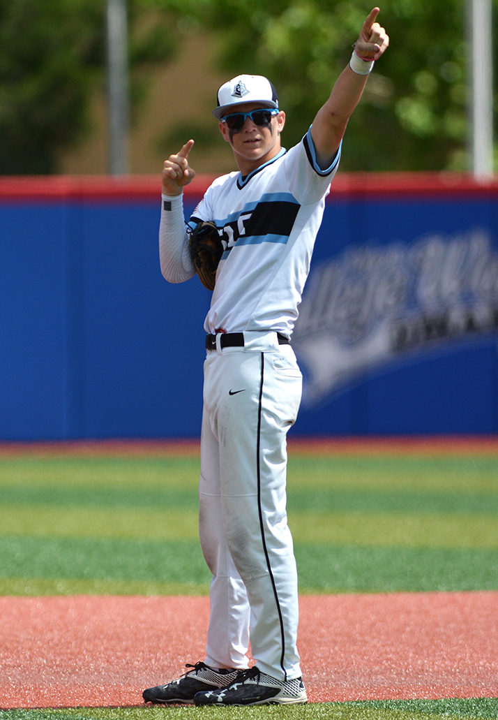 Junior Trevor Thompson salutes the crowd after a play at second base. Photo by Joseph Cline