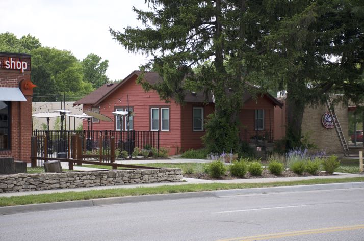 The coffee shop will be in the small house next to the restaurant.