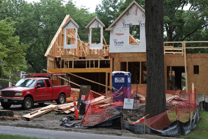 Two workers were injured when a wall being erected on the second floor of this house collapsed on them.