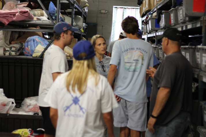 Krissi Wiggins, SME SHARE coordinator, discusses the night's work helping homeless people with students.
