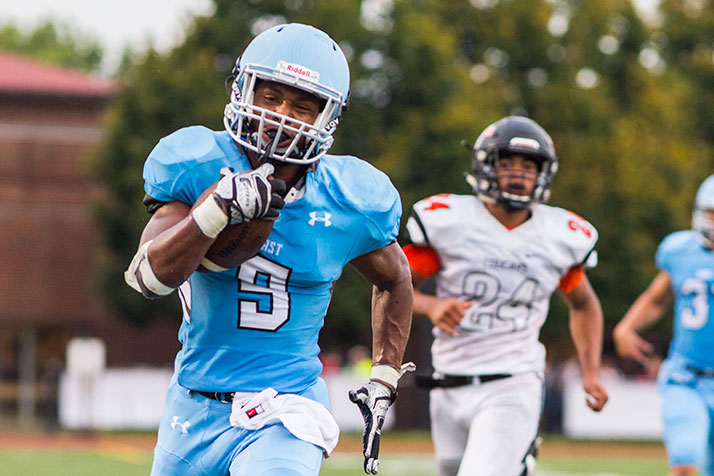 Running back Nigil Houston, who transferred to SM East from SM West this year, sprinted away from the Cougars defenders for one of his first half touchdowns.