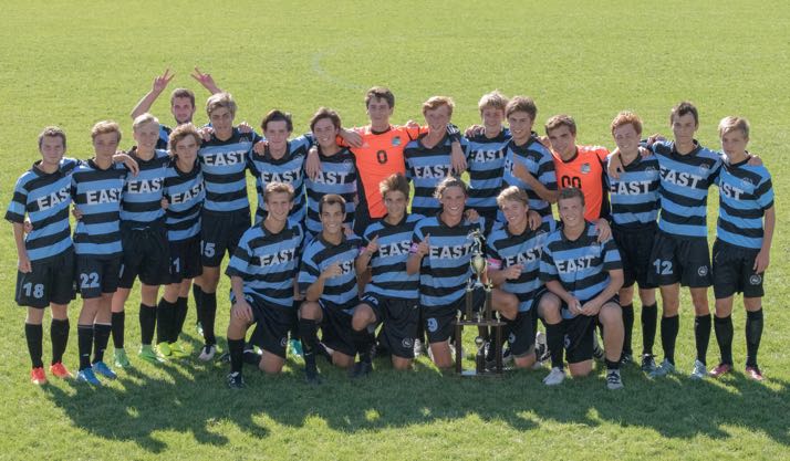 The SM East boys soccer team celebrates its tournament win. Photo by Carrie Armstrong