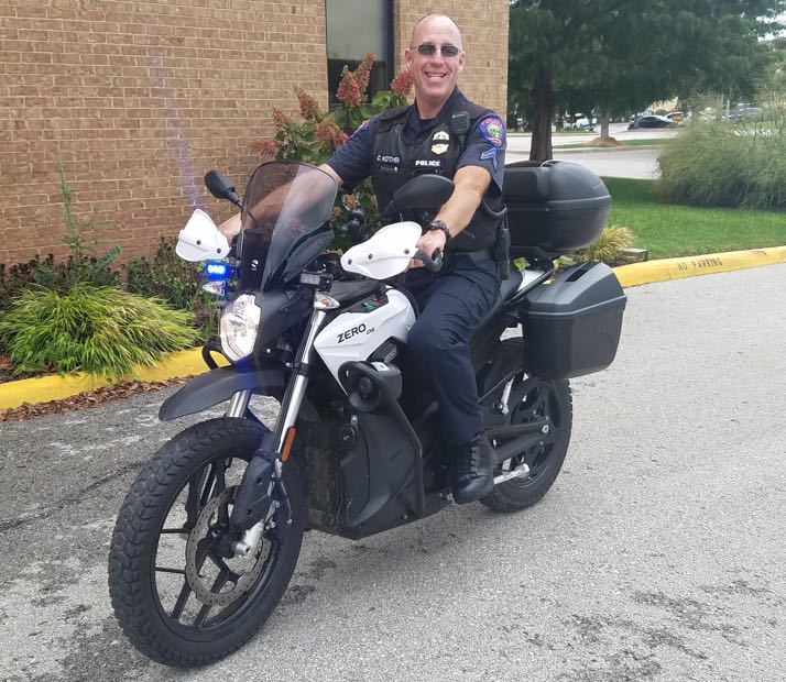 Roeland Park officer Charlie Kotcher sits on the bike in the city hall lot.