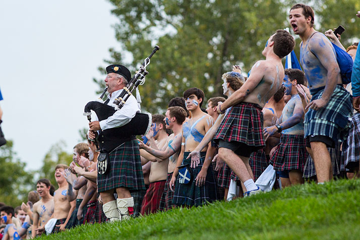 Rockhurst students, dressed as Scottish warriors, lined the hill above the stadium before the game.