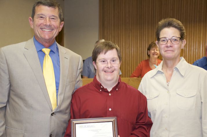 Mission Mayor Steve Schowengerdt and Parks Director Christy Humerickhouse flank Lee Jones who received a proclamation declaring Lee Jones day in the city.